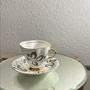Elegant Gold and Blue Floral Teacup and Saucer